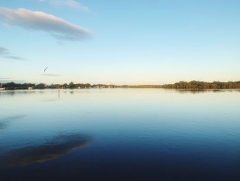 Scenic view of lake against blue sky