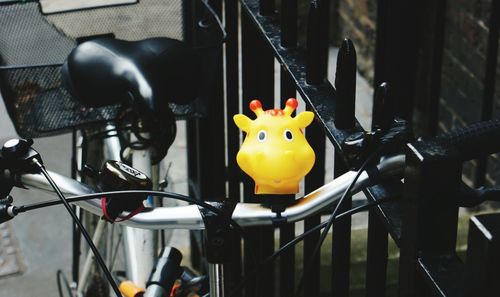 Close-up of toy hanging on wall