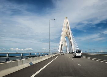 Bridge over road against sky