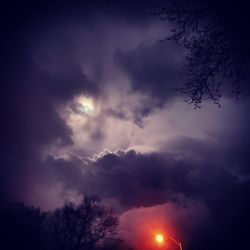 Low angle view of silhouette trees against sky at sunset