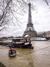 View of ship in river - tour eiffel and flood