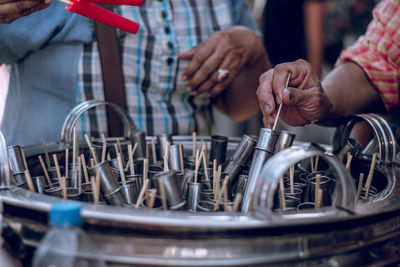 Cropped image of market vendor selling flavored ice