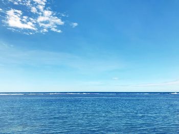 Scenic view of sea against blue sky