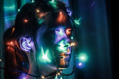 Portrait of woman with illuminated lights