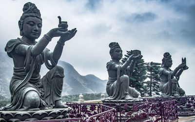 Low angle view of statue against sky