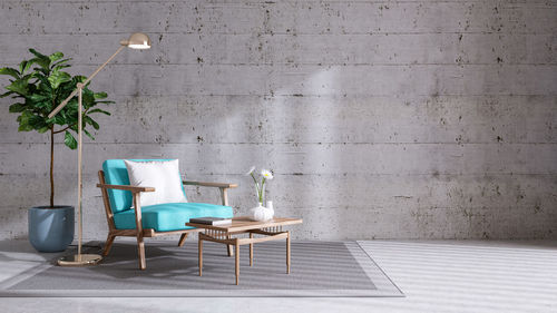 Empty chairs and table against wall at home