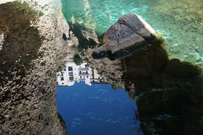 High angle view of rock formation by sea