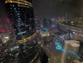 High angle view of illuminated buildings in city at night
