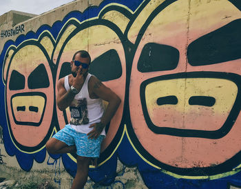 Full length of young man wearing sunglasses