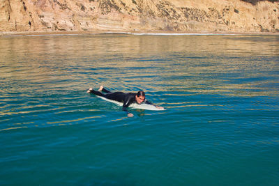 Man swimming in sea