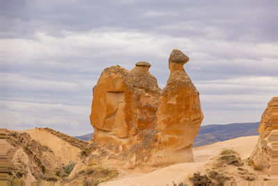 Rock formations on mountain against sky
