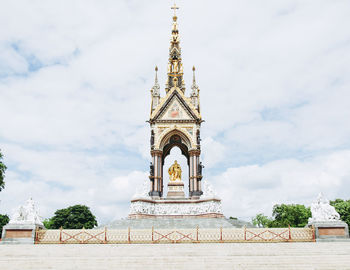 Traditional building against cloudy sky