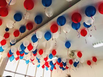 Low angle view of multi colored balloons