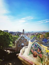 High angle view of buildings against cloudy sky