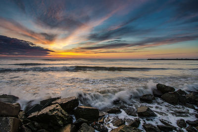 Scenic view of sea against sky during sunset