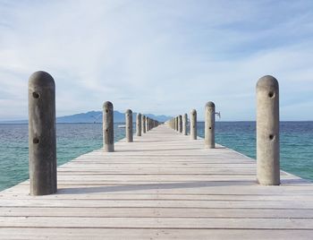 Pier over sea against sky