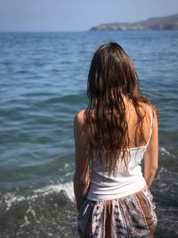 Rear view of woman looking at sea