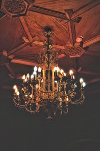 Low angle view of illuminated lanterns hanging at night