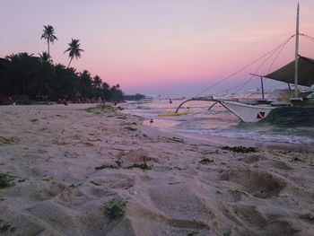 Scenic view of beach against sky during sunset