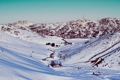 Scenic view of snow covered mountain against sky