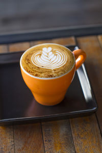 Close-up of cappuccino on table