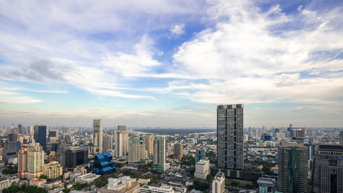 High angle view of modern buildings in city against sky
