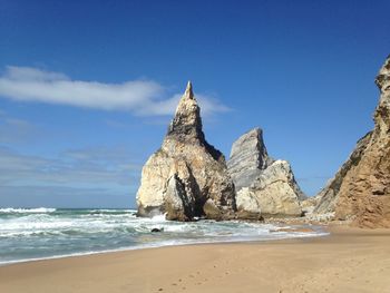 View of beach against cloudy sky