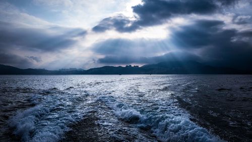 Scenic view of sea against cloudy sky