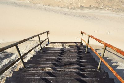 High angle view of empty staircase at beach