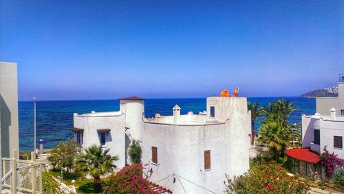 View of calm sea against clear blue sky