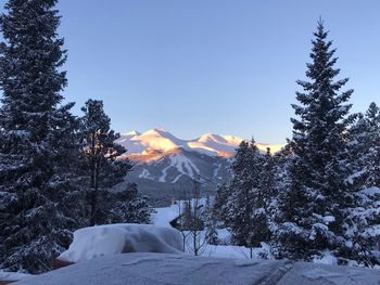 Scenic view of snow covered mountains against sky