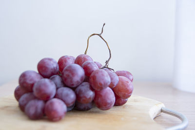 Close-up of grapes on table