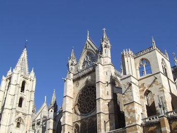 Low angle view of church against blue sky