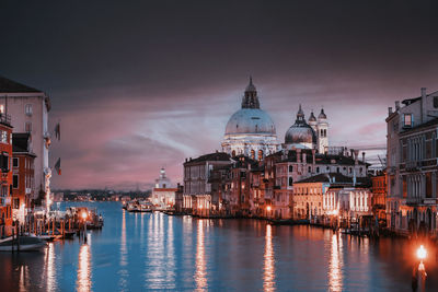 View of illuminated buildings at waterfront