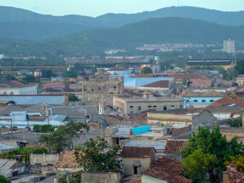 High angle view of townscape and mountains