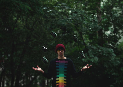 Full length of man standing against trees