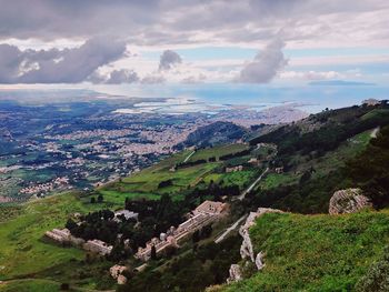 Aerial view of landscape against cloudy sky