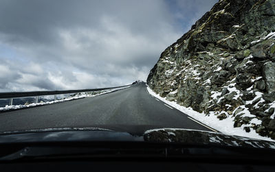 Road seen through car windshield