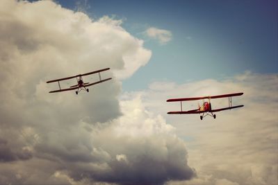 Low angle view of helicopter against sky