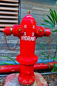 Close-up of fire hydrant against wall