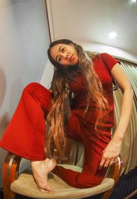 Young woman sitting in traditional clothing