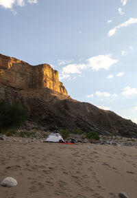 View of desert against cloudy sky