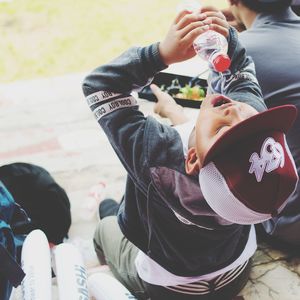 Rear view of boy holding ice cream