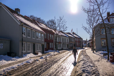 Man walking on snow covered landscape