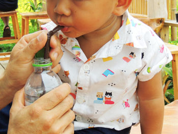 Midsection of boy holding ice cream