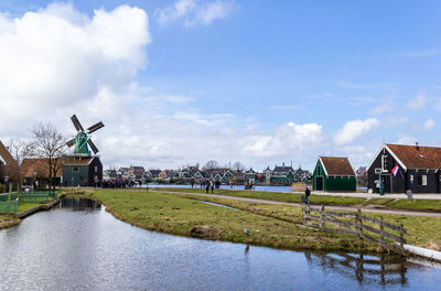 Traditional dutch windmill village with canal