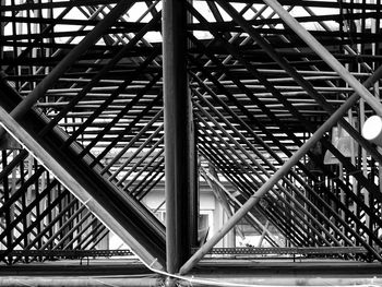 Low angle view of footbridge in city