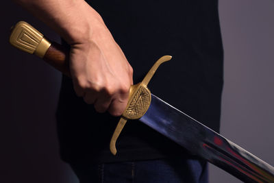 Midsection of man holding ice cream