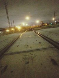 View of railroad tracks at night