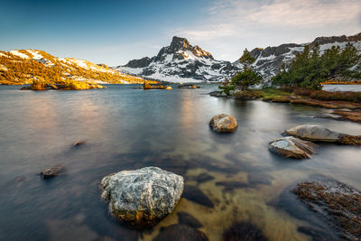 Scenic view of lake against sky during winter